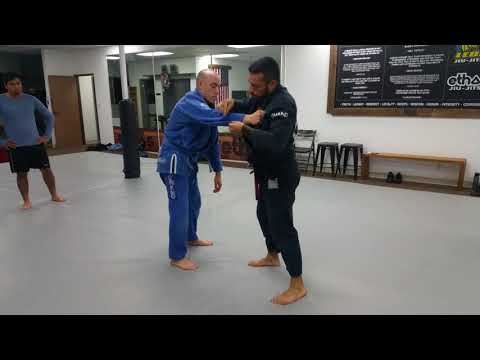 Double leg takedown with grip break