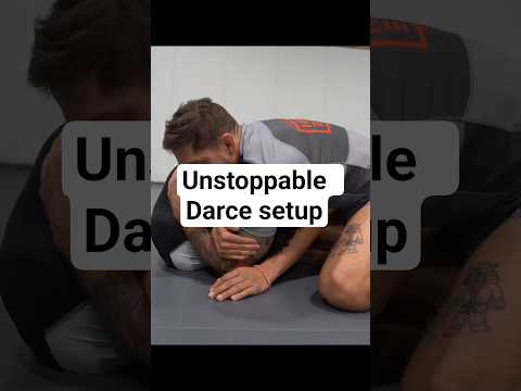 Standing front headlock into the Darce