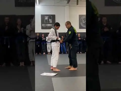 Prof. Leka getting promoted to 6th degree Black Belt by Master Leo Vieira