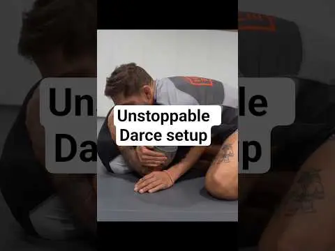 Standing front headlock into the Darce