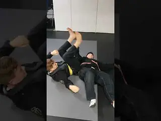 Armbar from the back when opponent is standing.